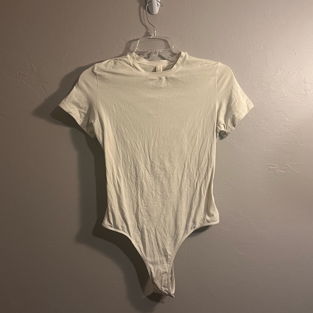 SKIMS Short Sleeve Crew Bodysuit in Ivory Cream - Picture 4 of 16